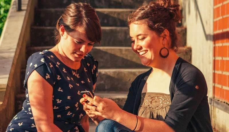 Students browsing on their phones