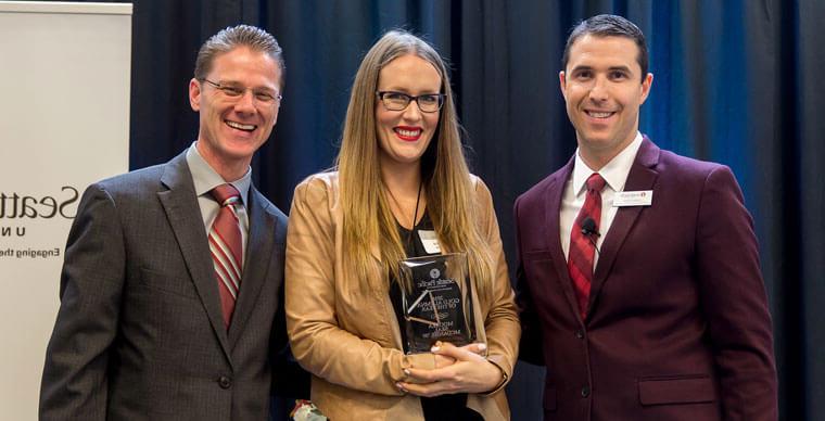 Moorea Seal McDaniel receiving her Gold Alumni of the Year award